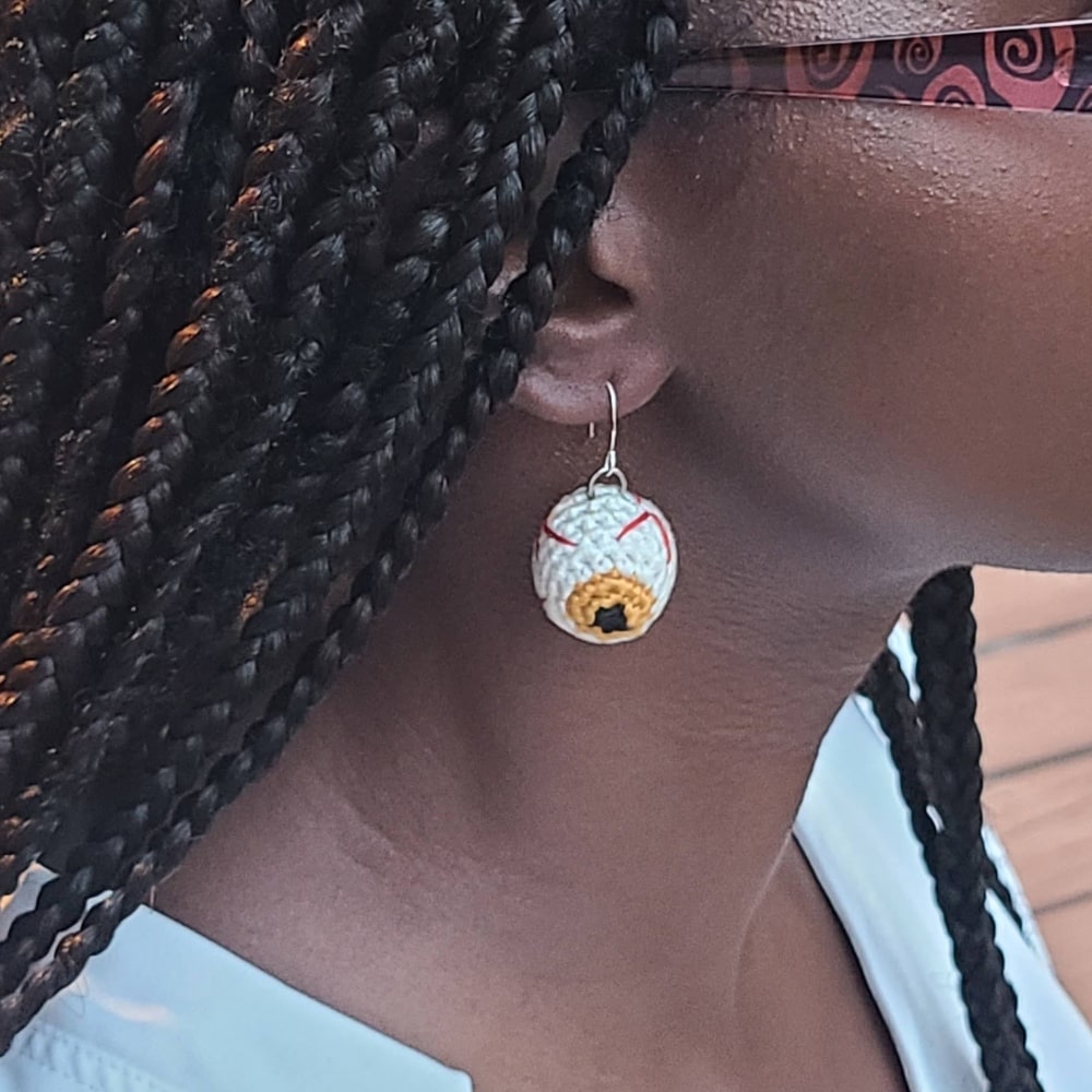Model wearing Halloween Eyeball earrings.
