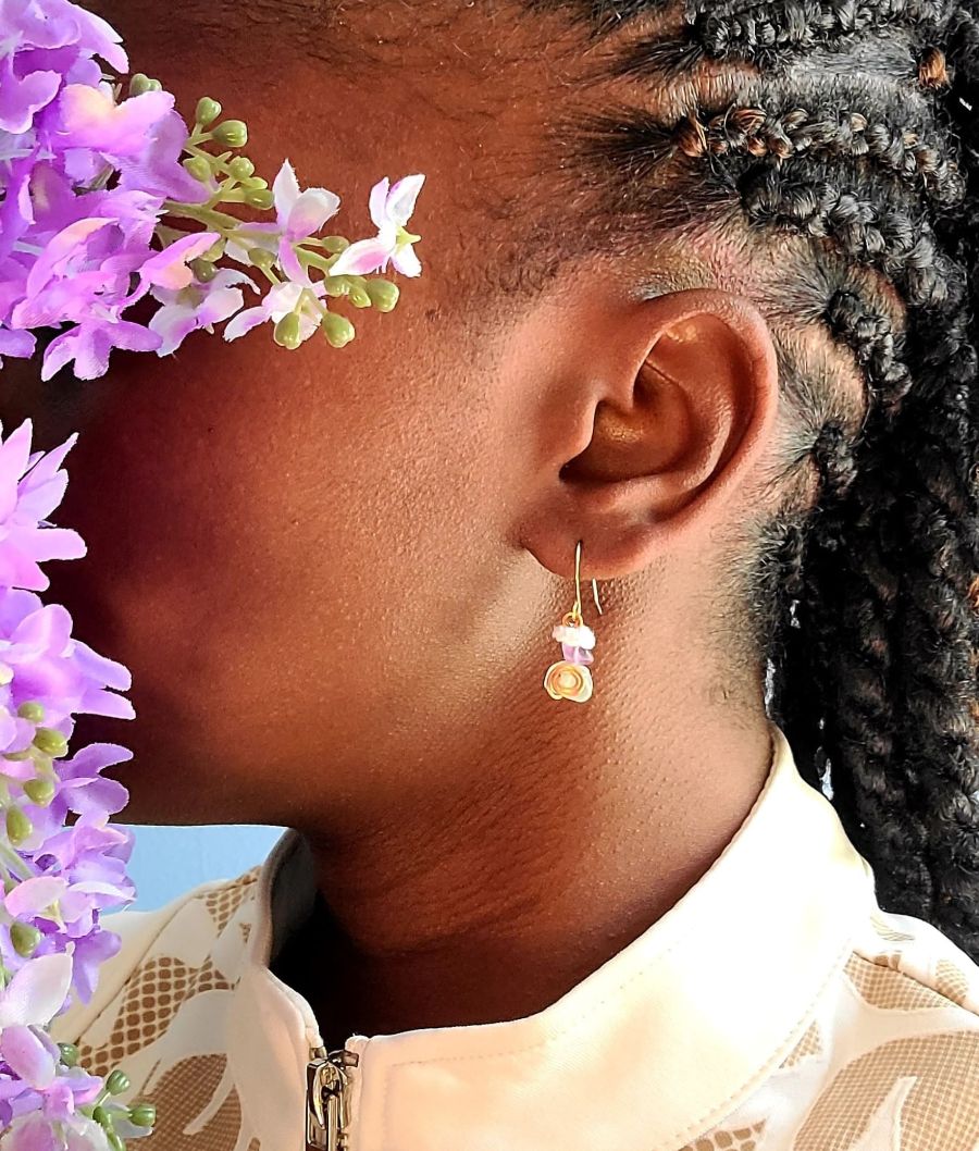Model wearing fluorite dangle earrings.