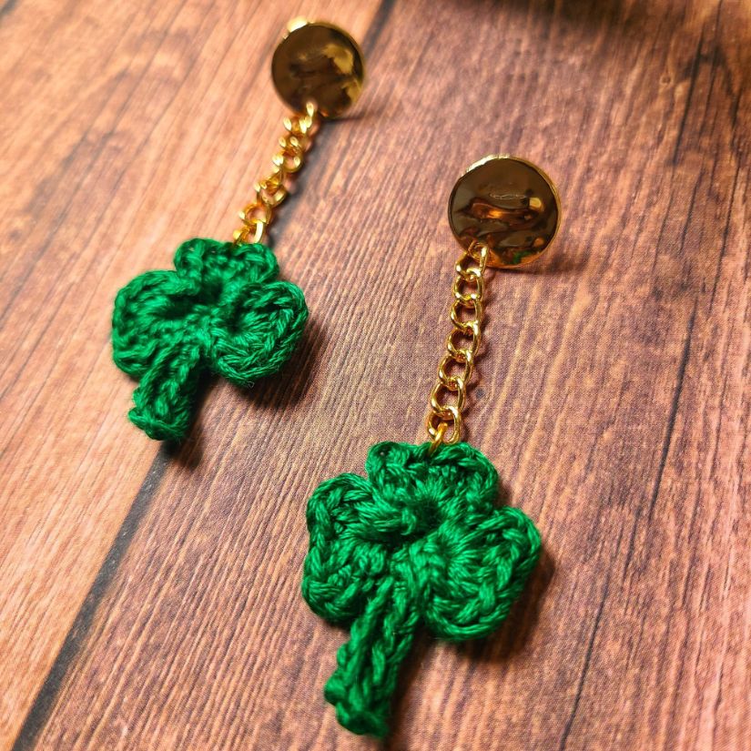 Post Shamrock dangle earrings with a chain.