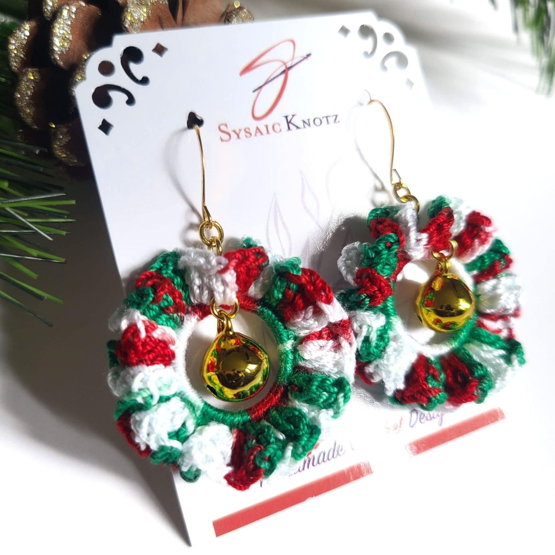 Christmas Wreath Earrings on white background for a close up.