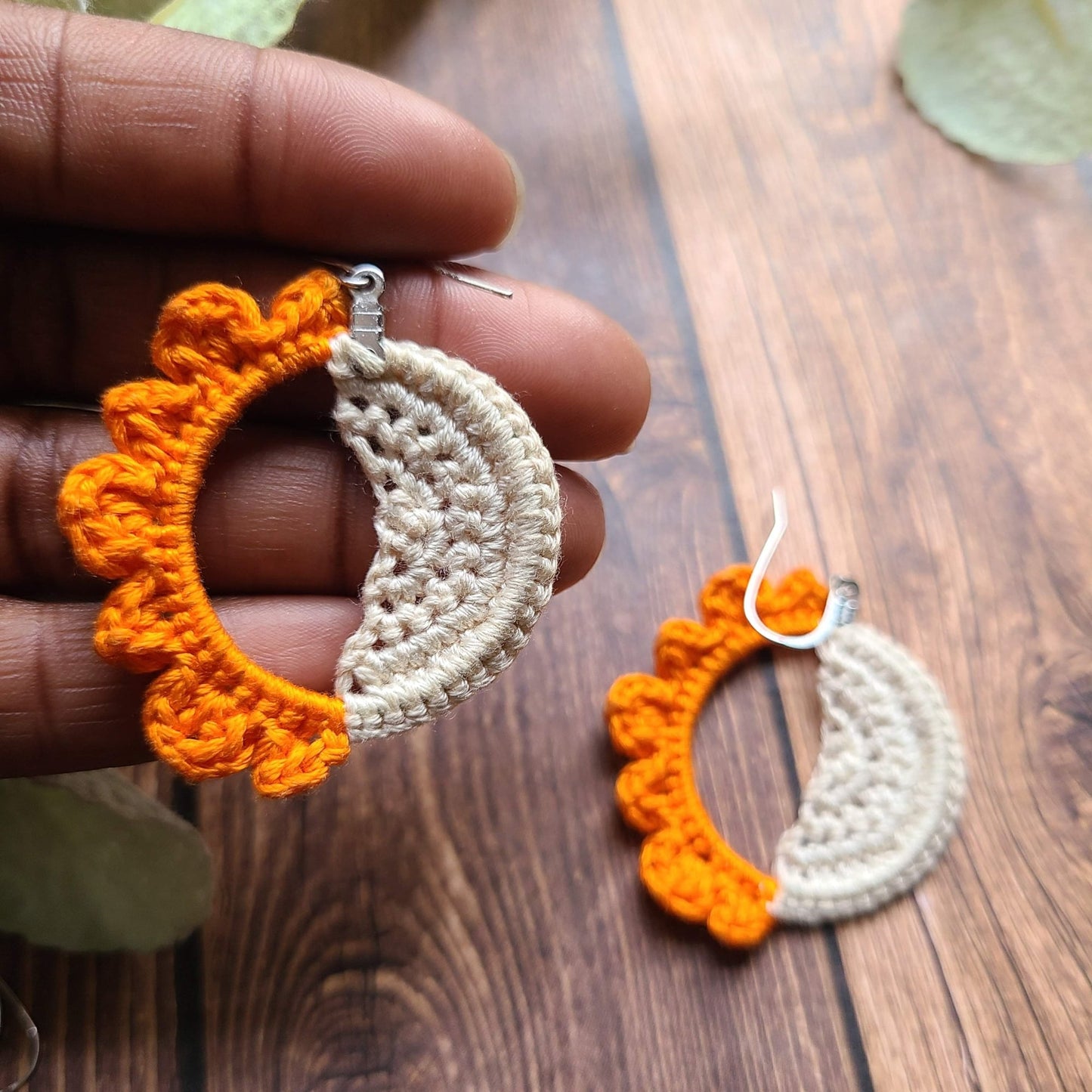 Close up for size of sun and moon earrings.