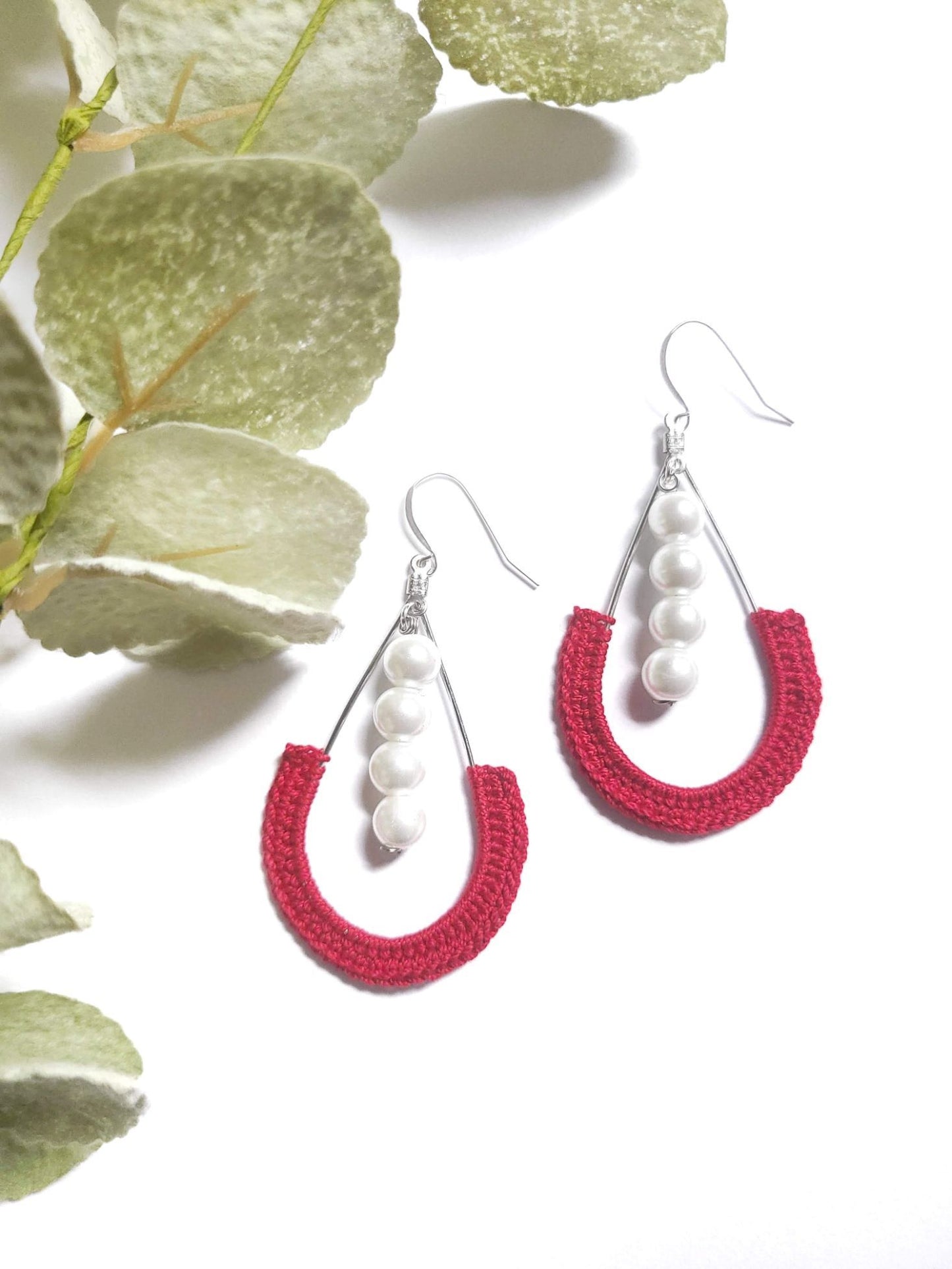 Red pearl dangle earrings.