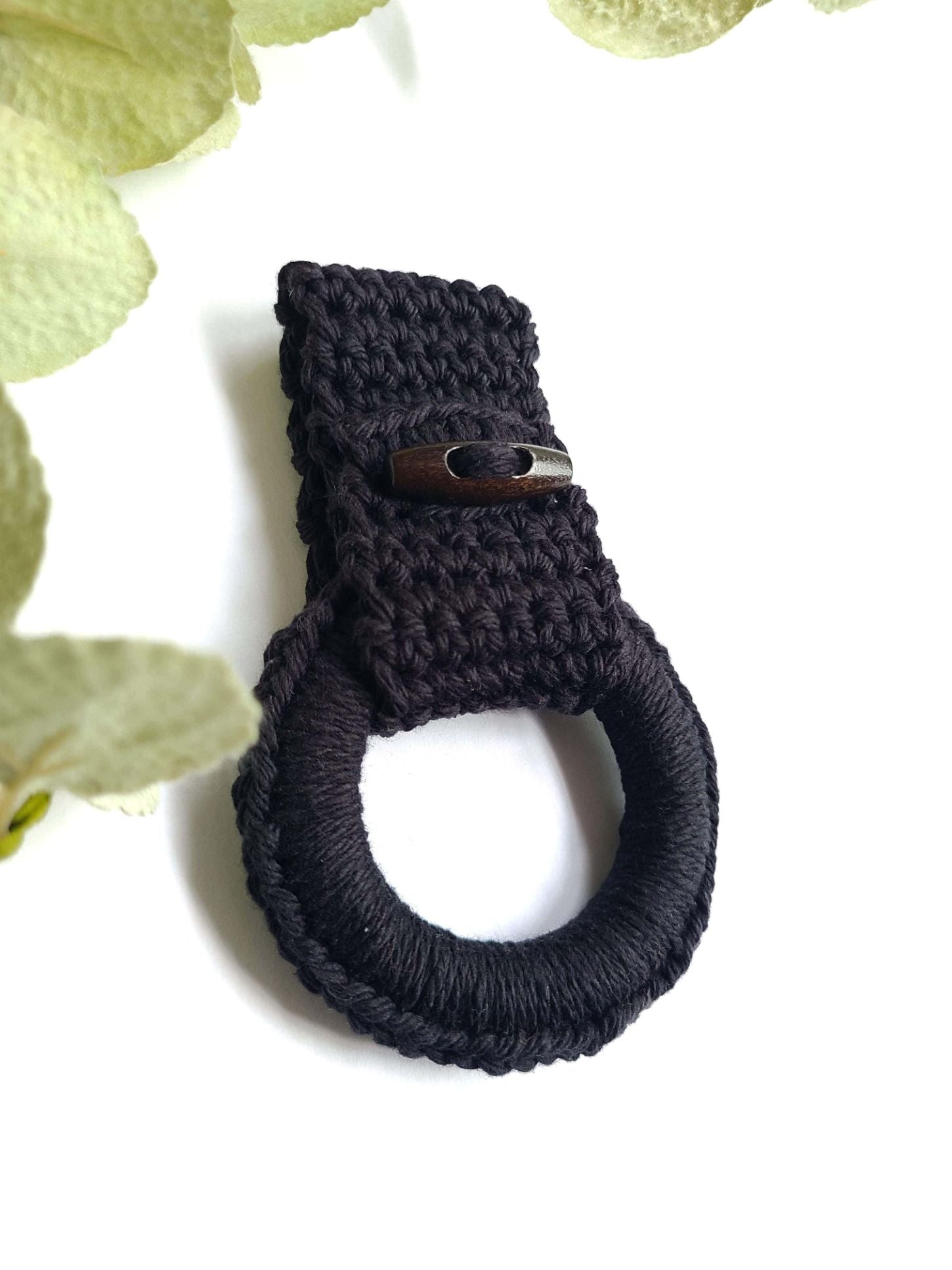 Black kitchen towel holder.