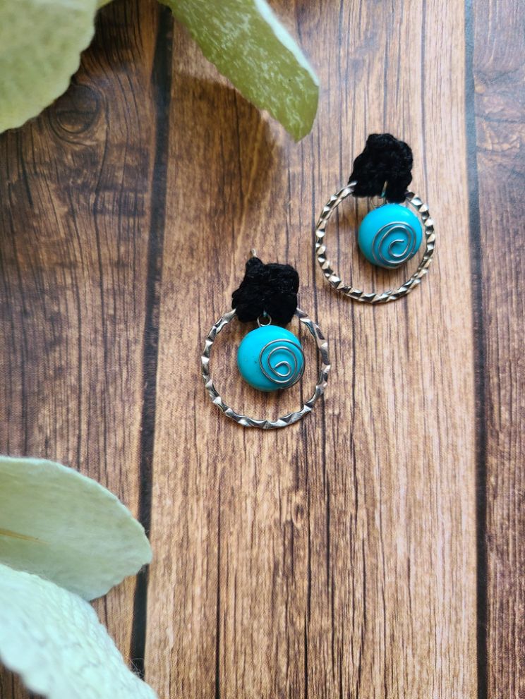 Lovely turquoise post earrings with black accents.