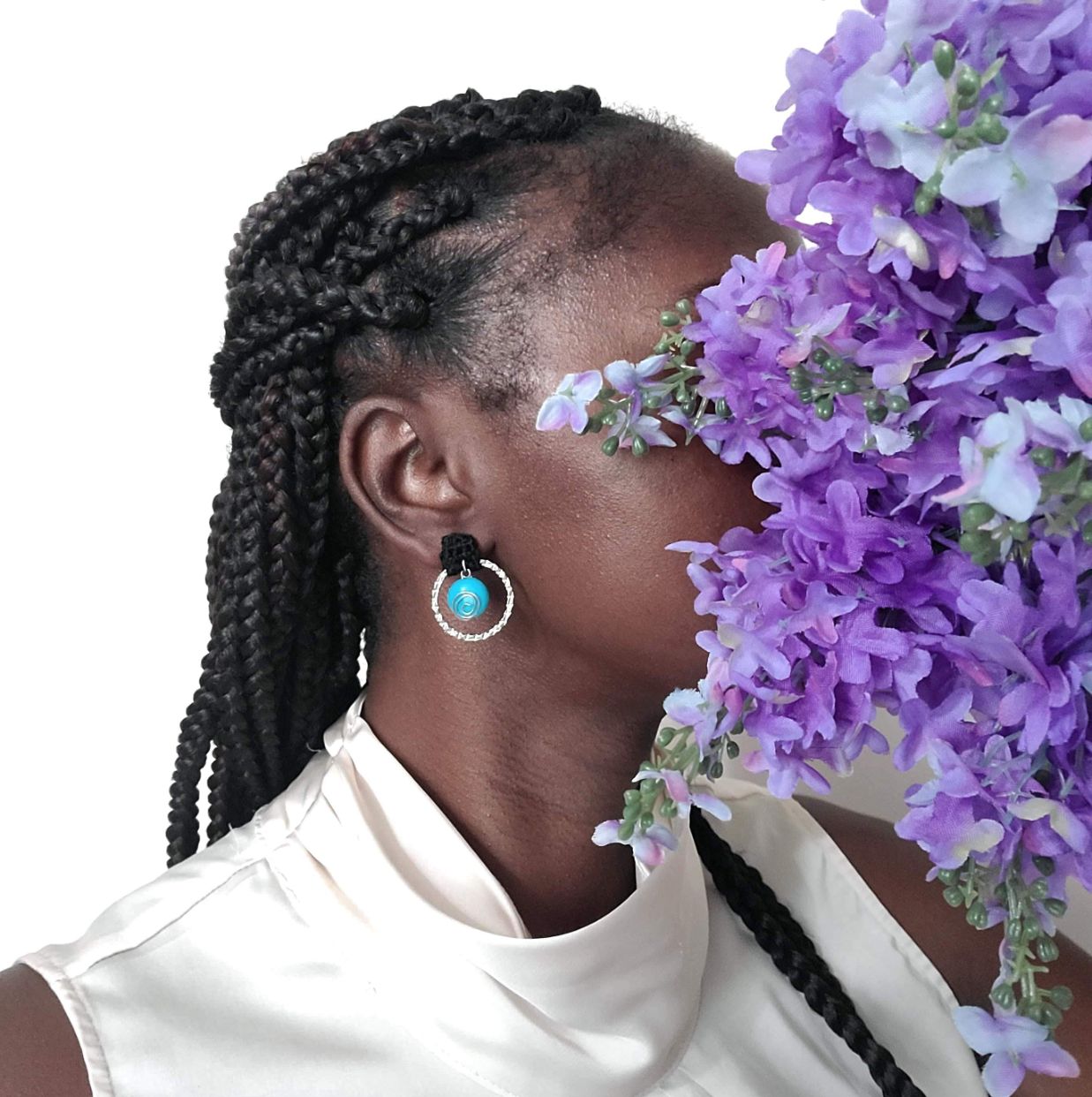 Model wearing crochet post earrings.