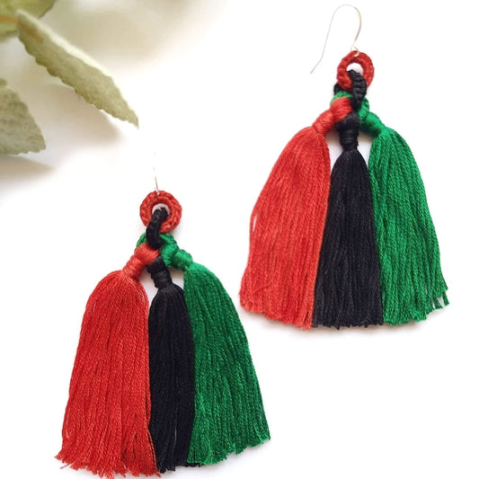 Beautiful long African flag color tassel earrings.