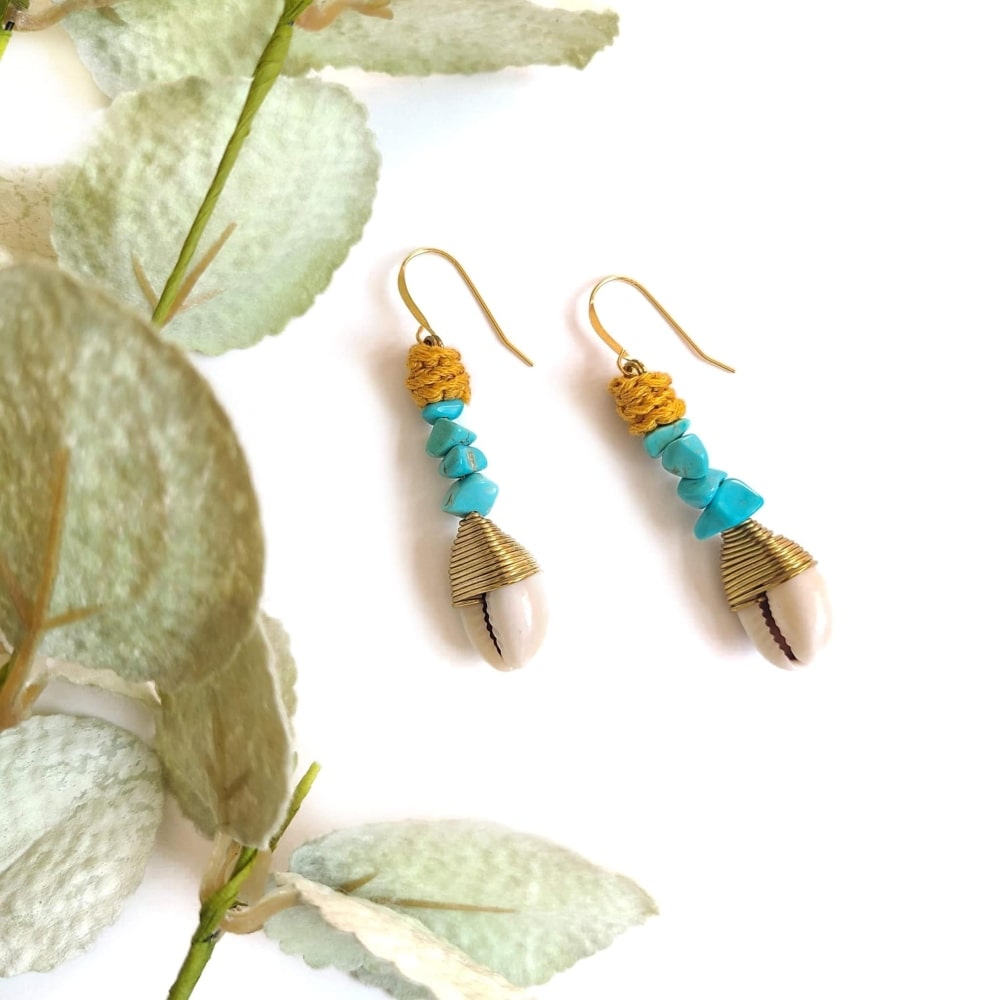 Wagnerite Turquoise earrings that dangle with a cowrie shell