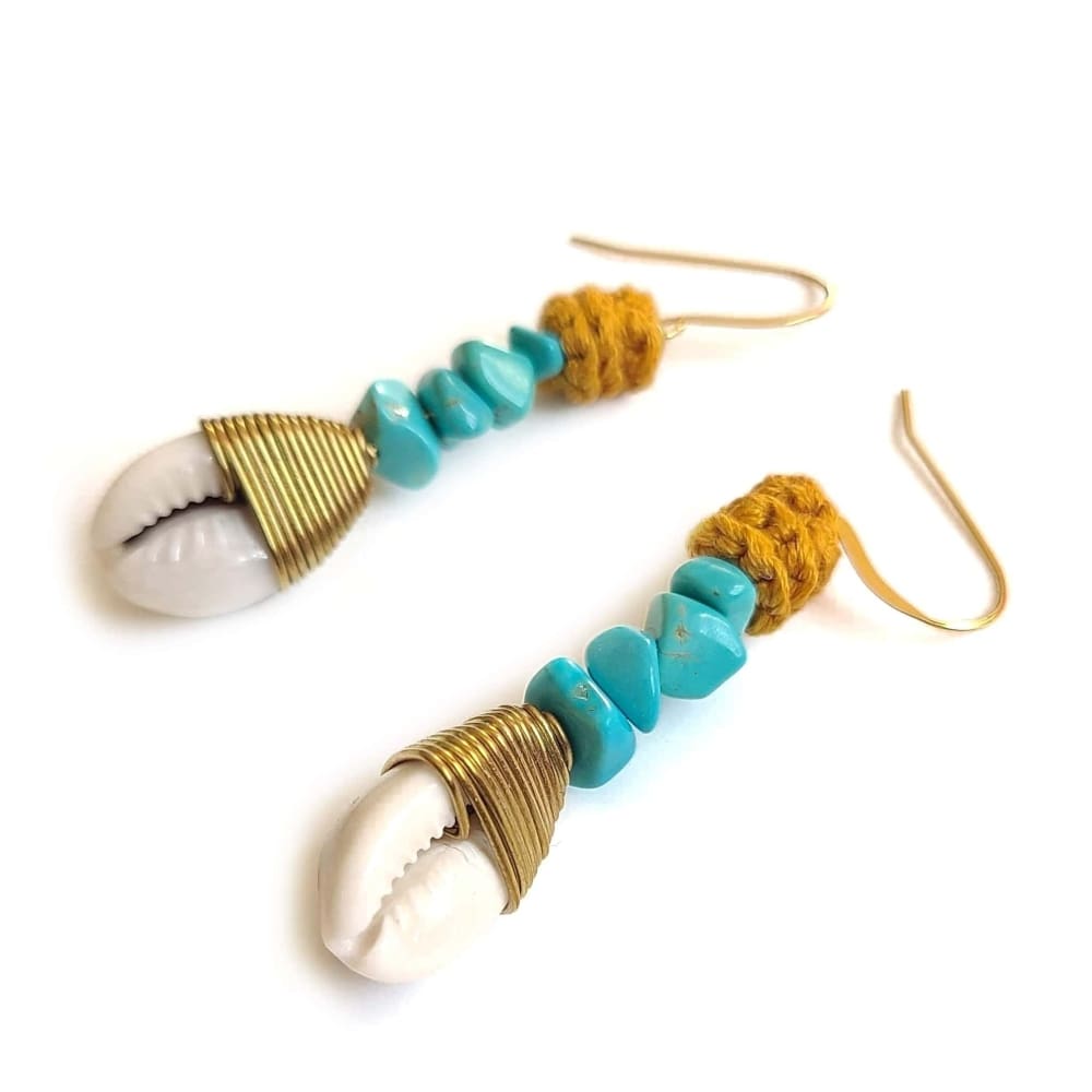 Wagnerite Turquoise earrings that dangle with a cowrie shell